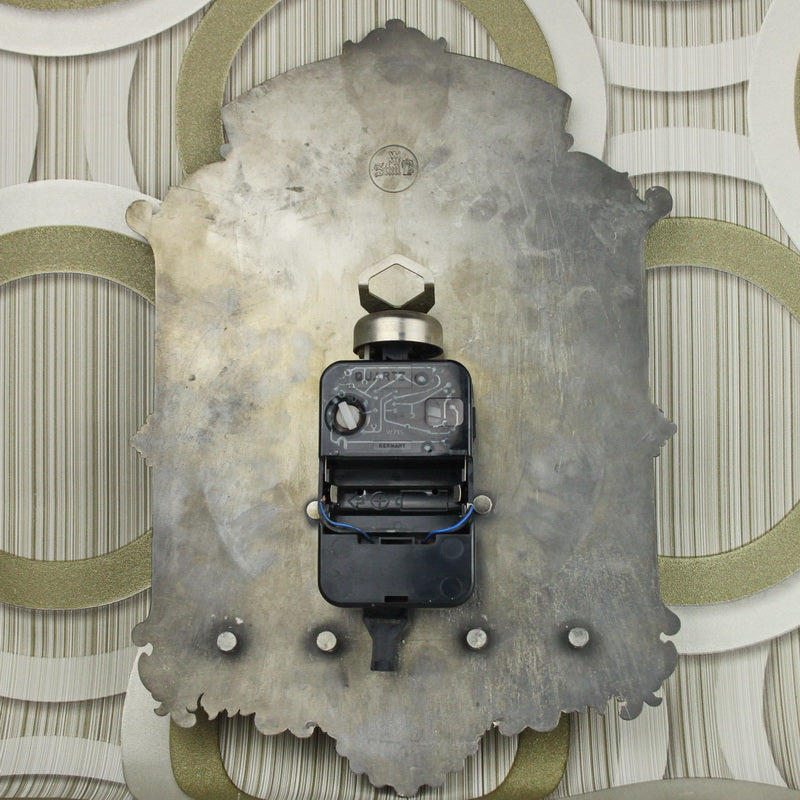 Vintage tin wall clock with pendulum. Reproduction of a painting by Rembrandt.