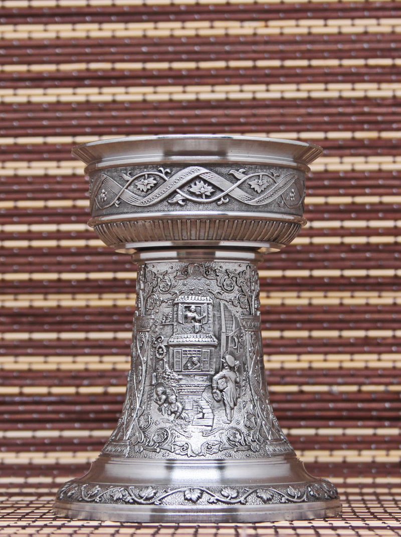 Vintage pewter candlestick. Bas-reliefs of paintings by K. Spitzweg