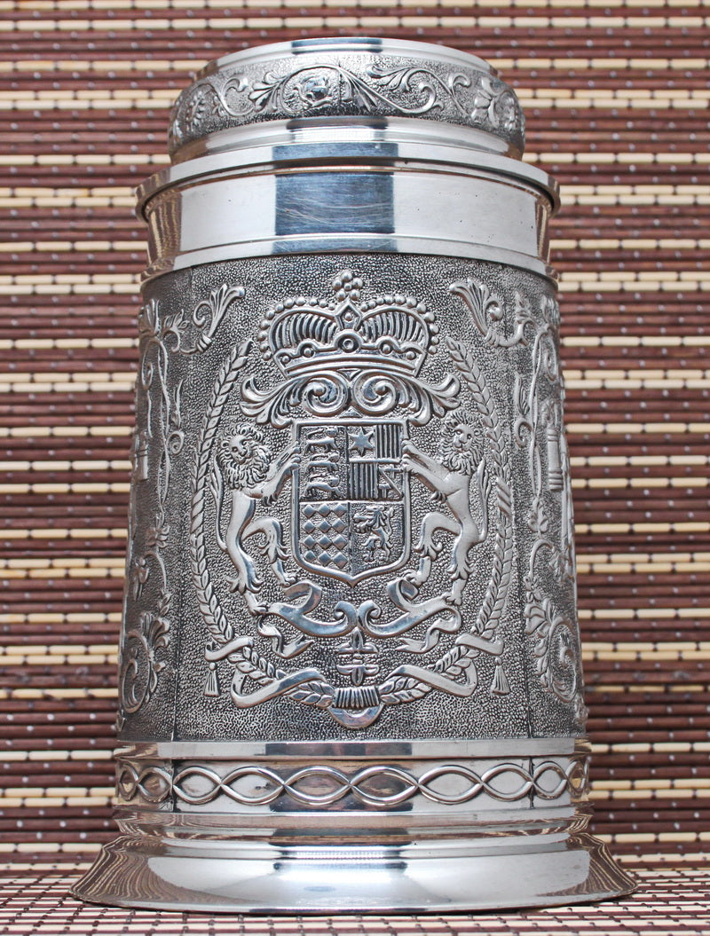 Large vintage pewter mug with bas-reliefs.