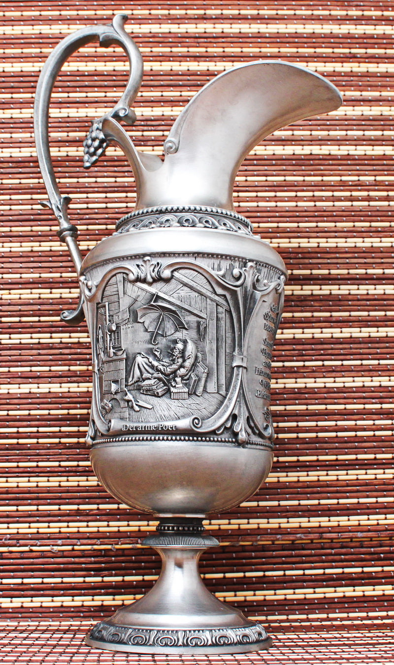 Pewter vintage jug. With bas-reliefs. Artist Karl Spitzweg