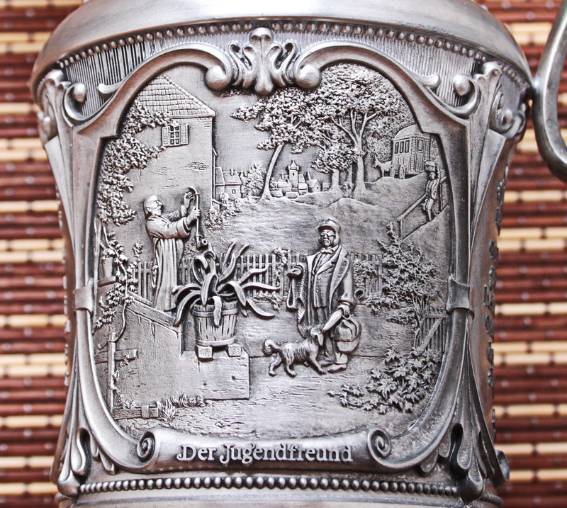 Pewter vintage jug. With bas-reliefs. Artist Karl Spitzweg