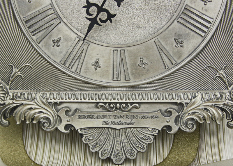 Vintage tin wall clock with pendulum. Reproduction of a painting by Rembrandt.