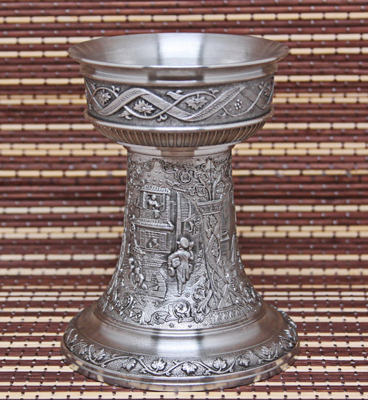 Vintage pewter candlestick. Bas-reliefs of paintings by K. Spitzweg