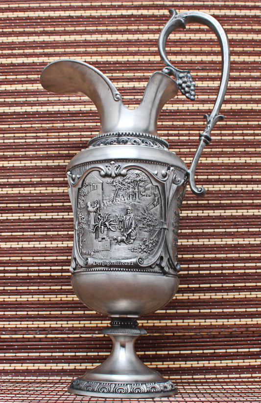 Pewter vintage jug. With bas-reliefs. Artist Karl Spitzweg